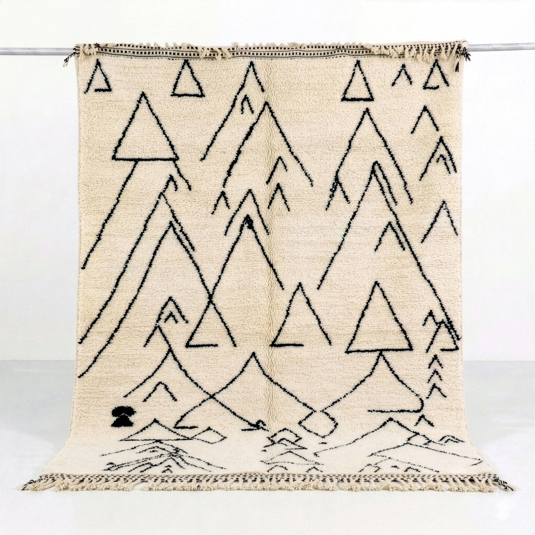 Beige rug with black triangle pattern on a white background