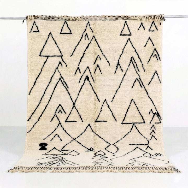 Beige rug with black triangle pattern on a white background