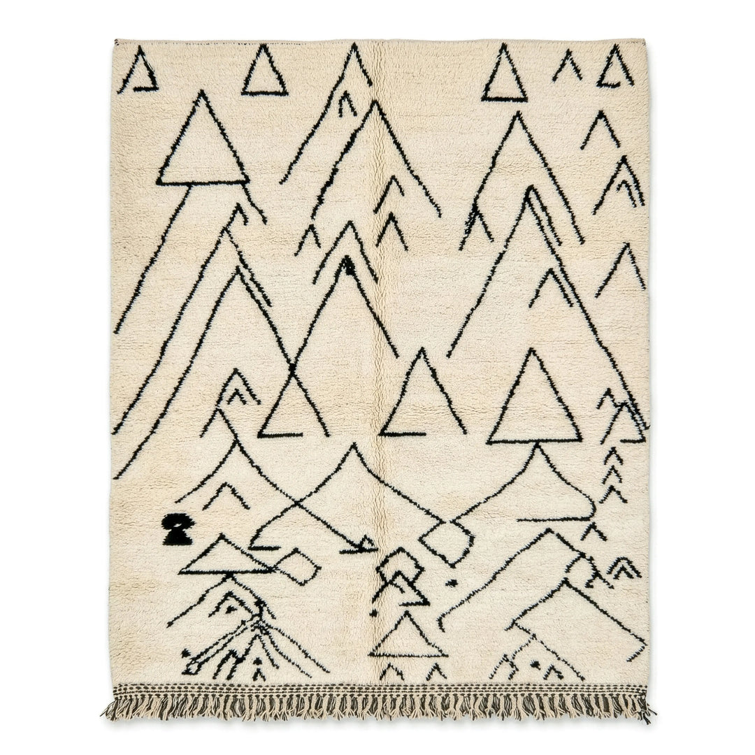 Beige rug with black geometric triangle pattern on a white background