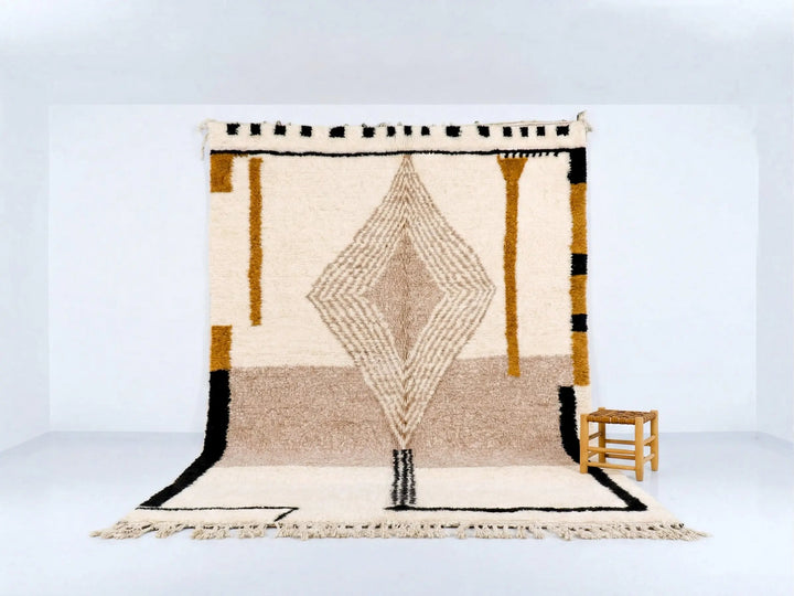 Geometric patterned rug with black, brown, and white design on a light blue background