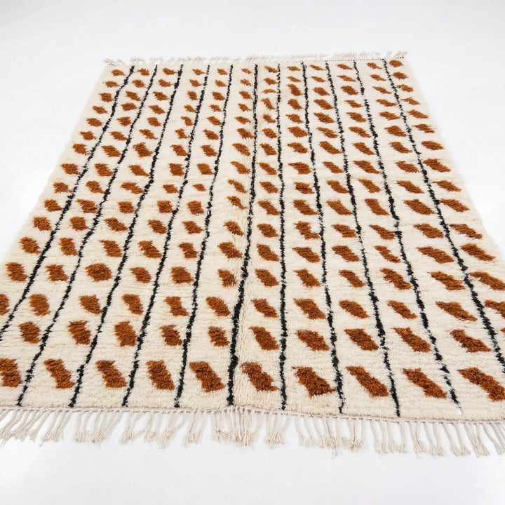 Beige rug with brown and black pattern on a white background