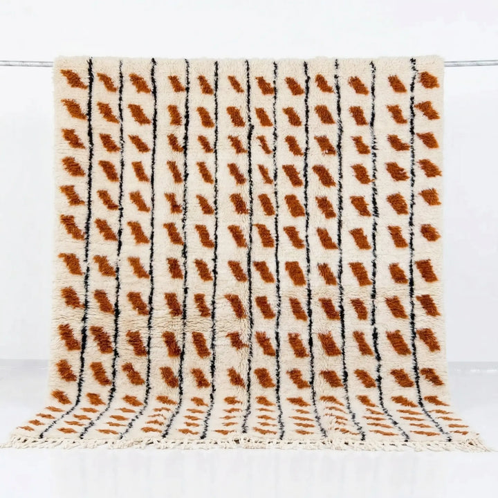 Textured blanket with brown and black pattern on a white background